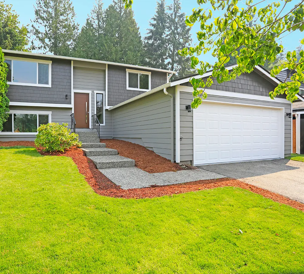 Beautiful split-level home with a fresh exterior upgrade and added square footage for enhanced family living.