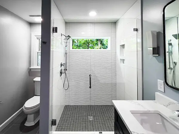 Modern bathroom with a spacious walk-in shower and sleek design.