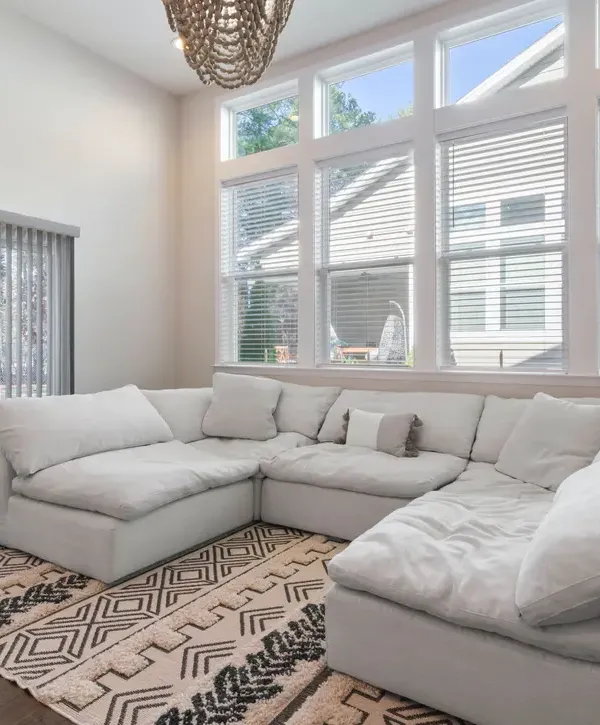 White sofa and window for home additions in Garner, NC